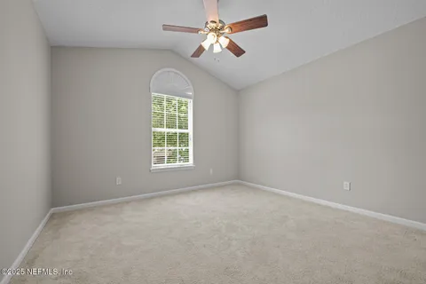 a view of backyard with swimming pool and outdoor seating