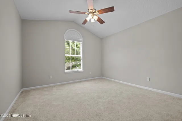 a view of backyard with swimming pool and outdoor seating