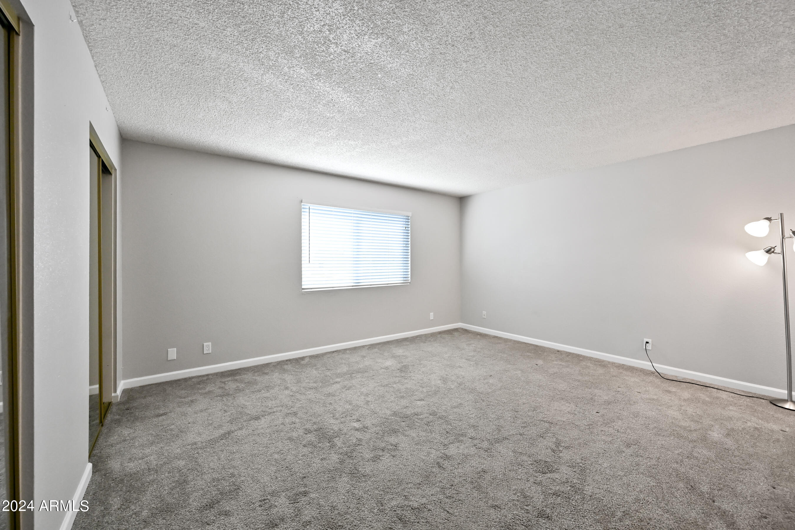 17009 East Calle Del Oro, Unit D Fountain Hills, AZ 85268 - Photo 13 of 18 an empty room with a empty space and windows