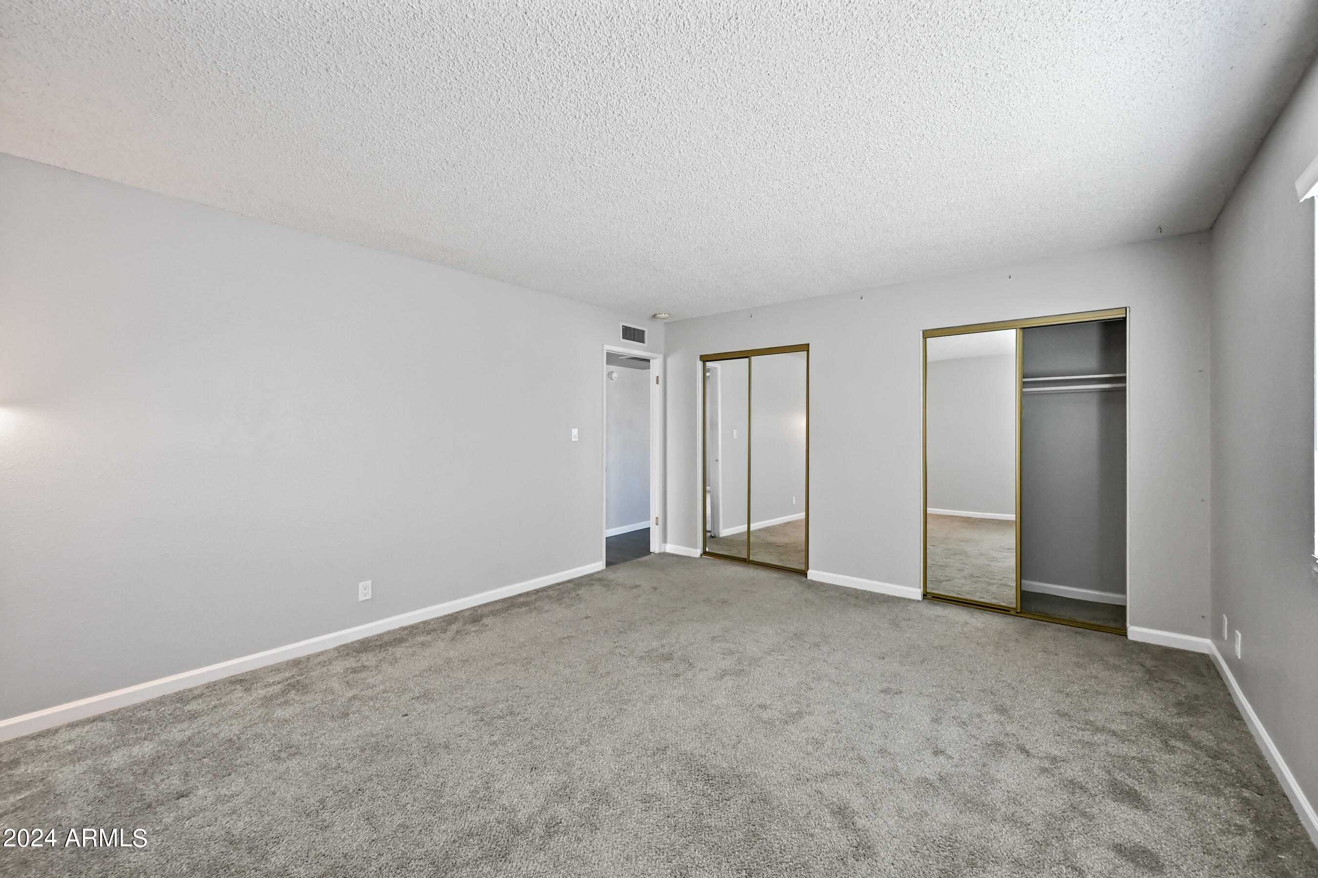 17009 East Calle Del Oro, Unit D Fountain Hills, AZ 85268 - Photo 14 of 18 an empty room with closet area