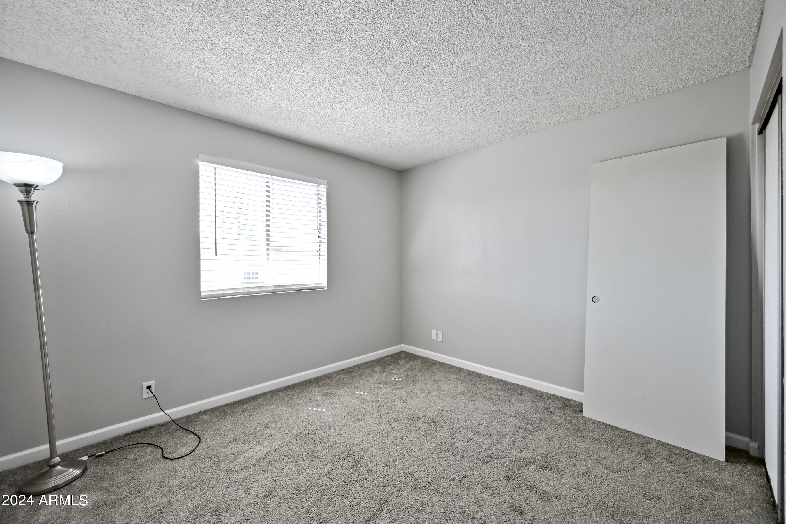 17009 East Calle Del Oro, Unit D Fountain Hills, AZ 85268 - Photo 15 of 18 an empty room with a window
