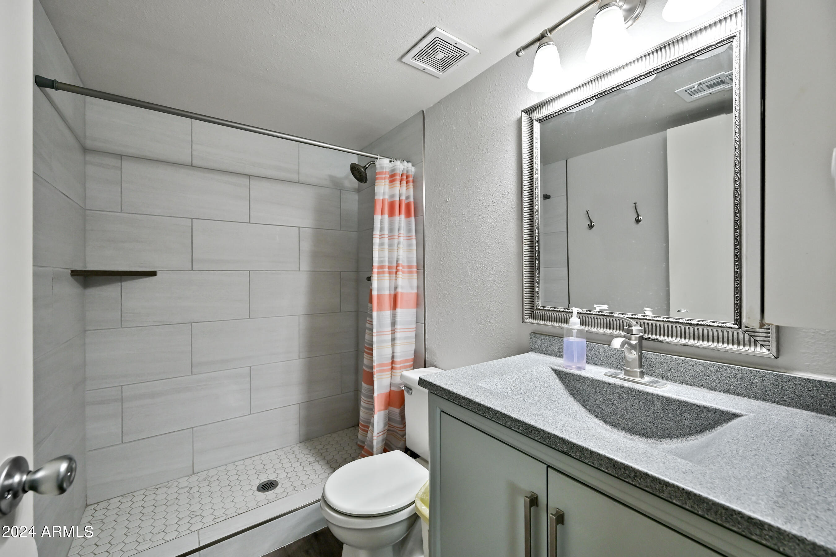 17009 East Calle Del Oro, Unit D Fountain Hills, AZ 85268 - Photo 16 of 18 a bathroom with a sink and a mirror