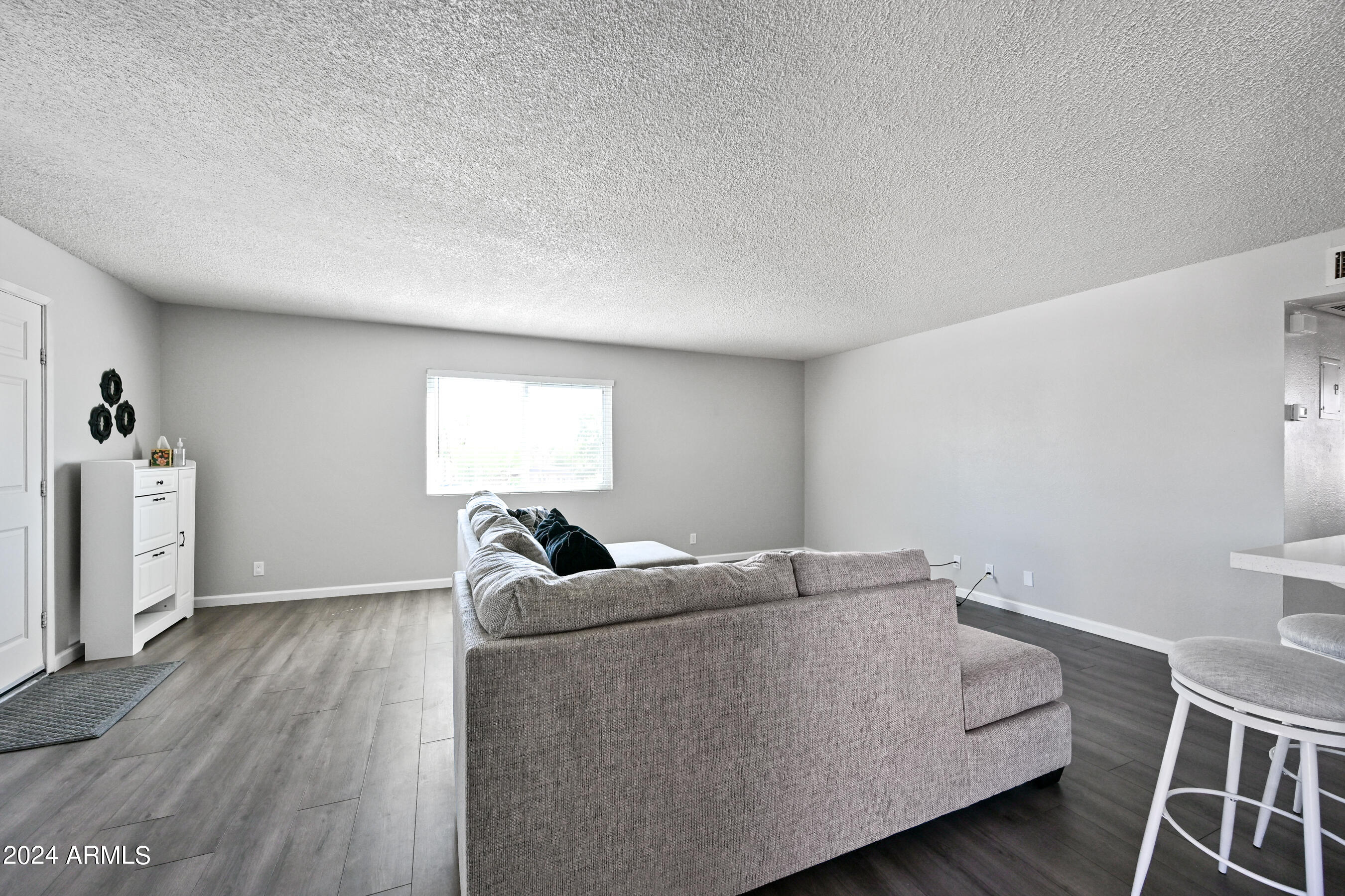 17009 East Calle Del Oro, Unit D Fountain Hills, AZ 85268 - Photo 4 of 18 a living room with furniture and a window