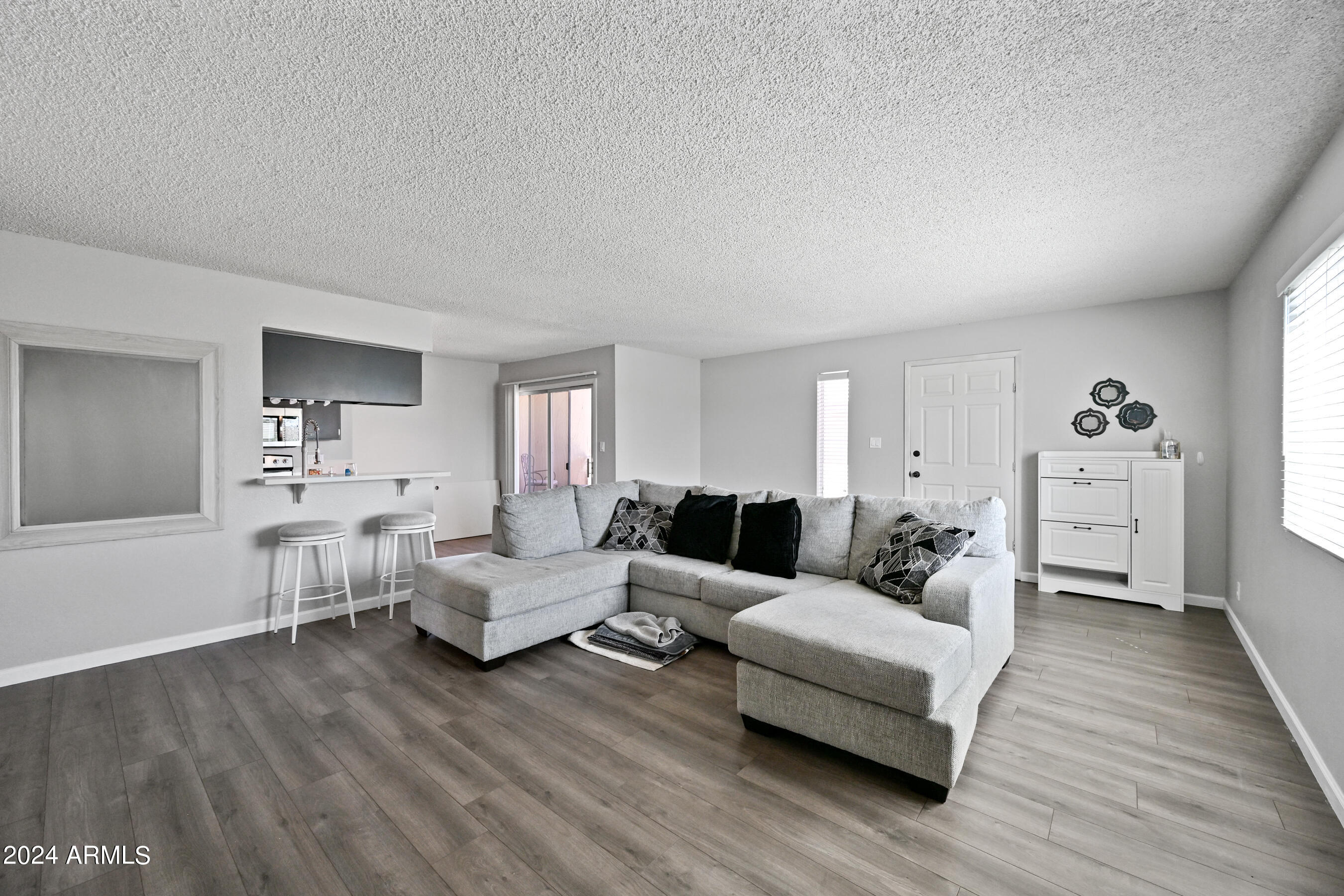 17009 East Calle Del Oro, Unit D Fountain Hills, AZ 85268 - Photo 5 of 18 a living room with furniture and a wooden floor