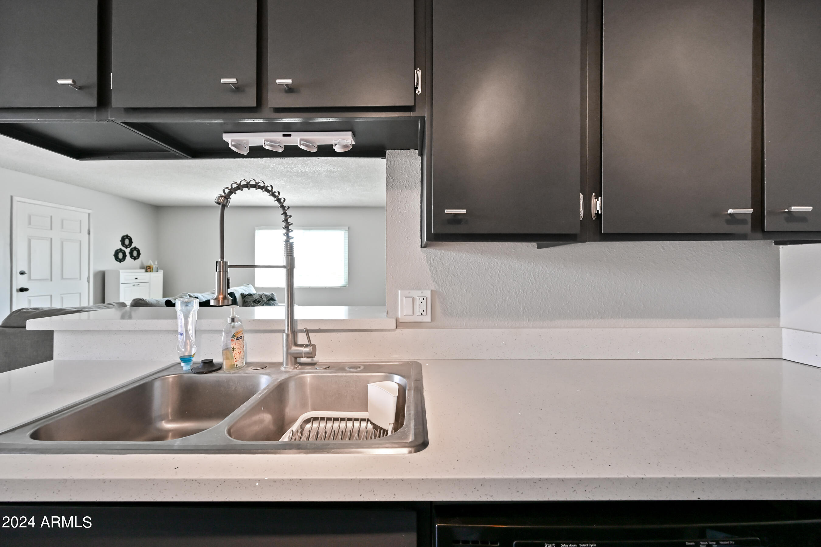 17009 East Calle Del Oro, Unit D Fountain Hills, AZ 85268 - Photo 8 of 18 a kitchen with a sink and a cabinets