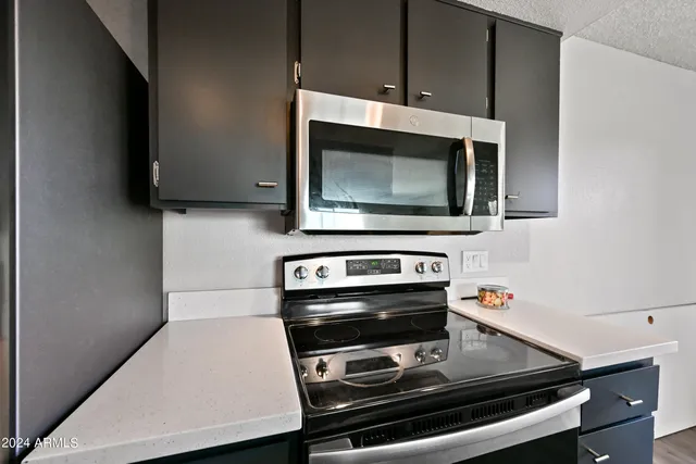 a kitchen with a stove and a microwave