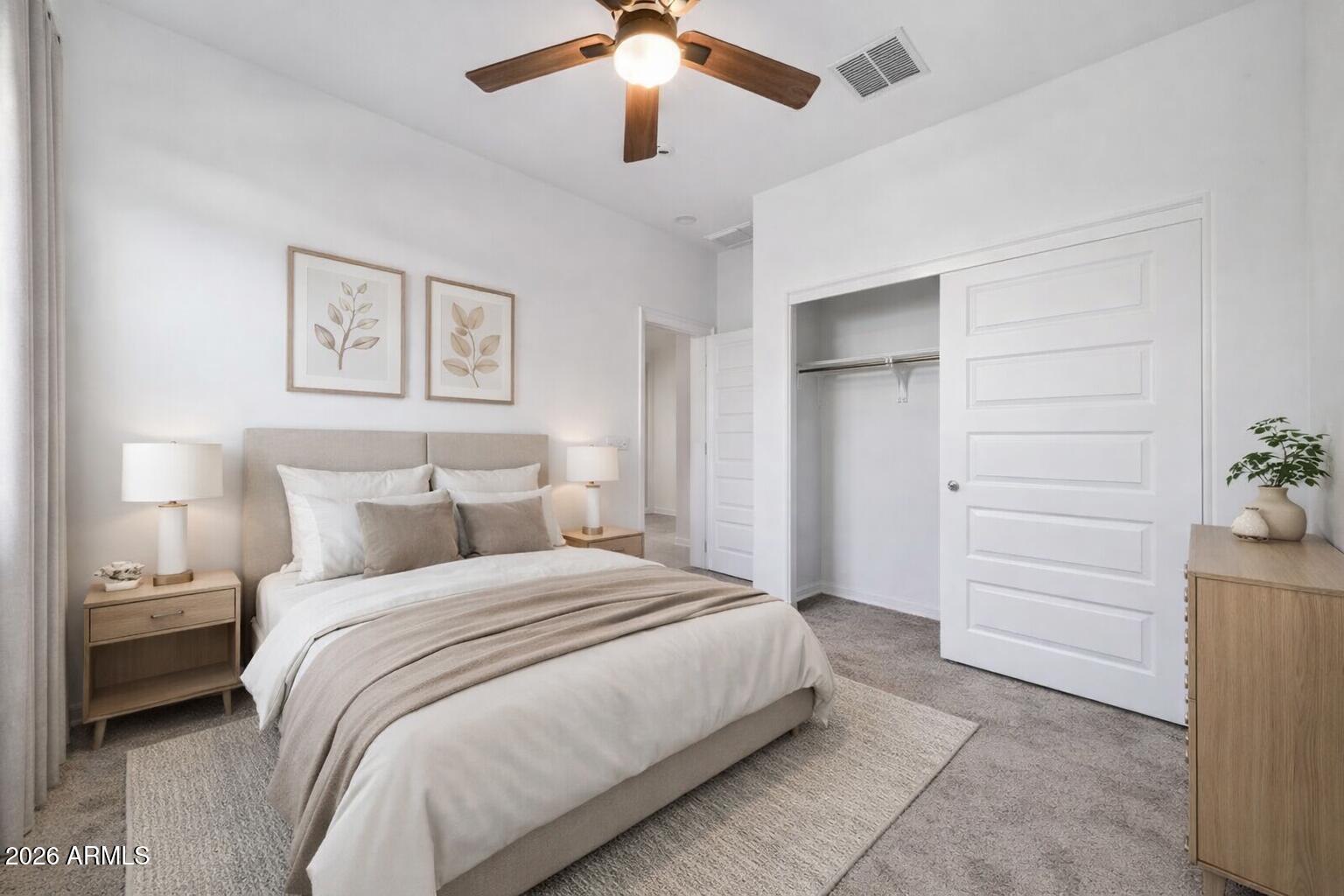 10223 West Piccadilly Road Avondale, AZ 85392 - Photo 15 of 35 a bedroom with a bed and a ceiling fan