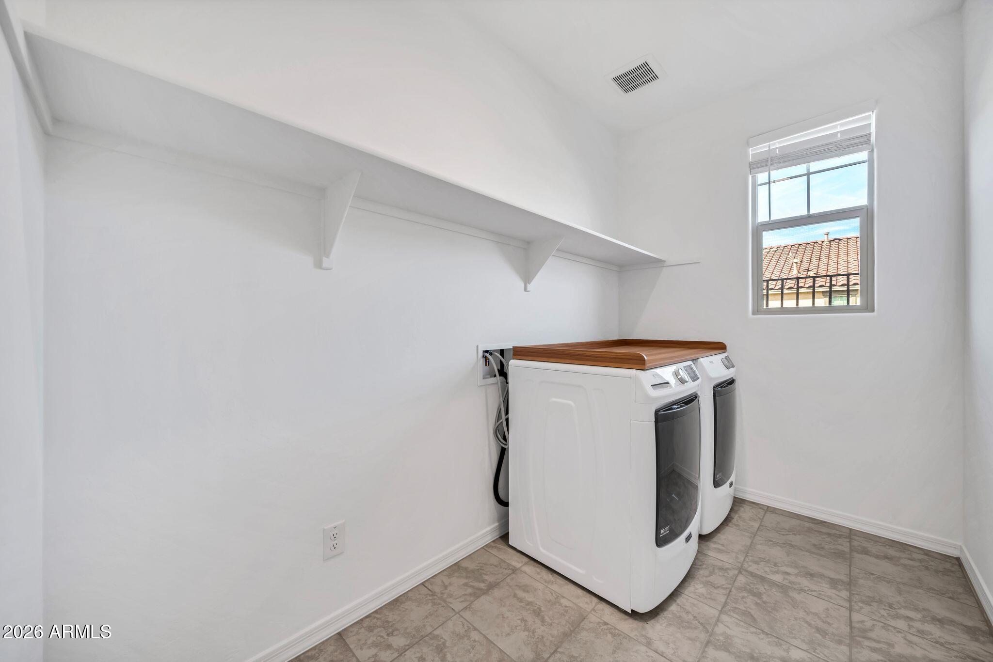 10223 West Piccadilly Road Avondale, AZ 85392 - Photo 20 of 35 a utility room with dryer and washer