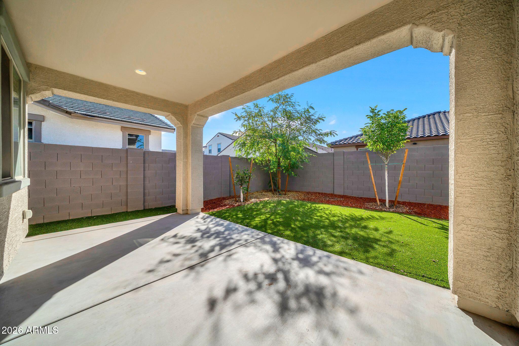 10223 West Piccadilly Road Avondale, AZ 85392 - Photo 22 of 35 a front view of a house with a yard and garage