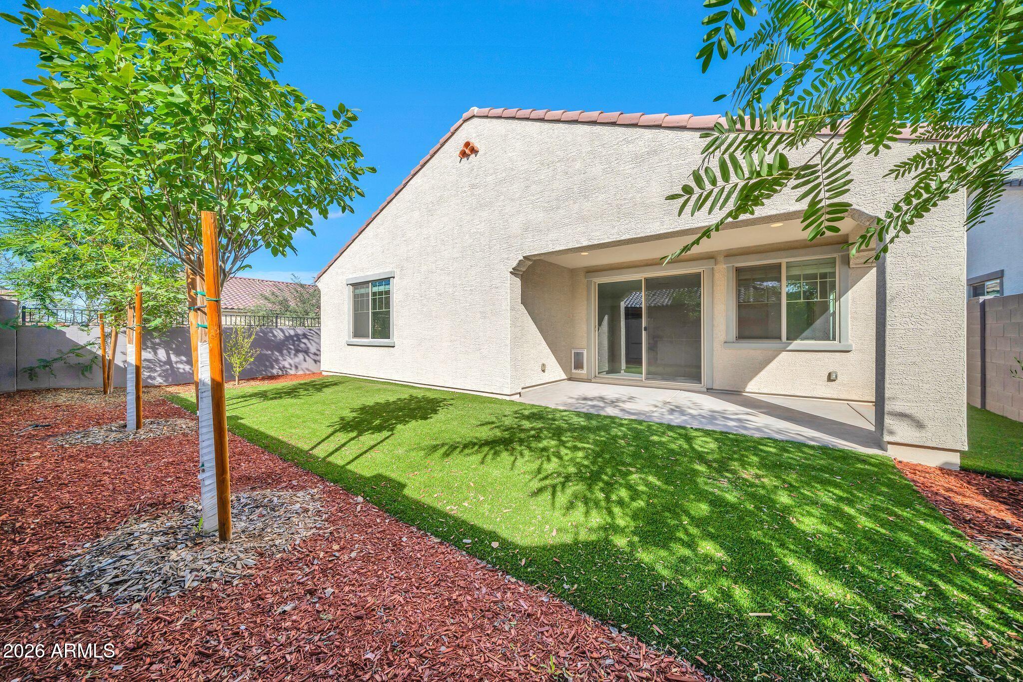 10223 West Piccadilly Road Avondale, AZ 85392 - Photo 23 of 35 a view of house with backyard
