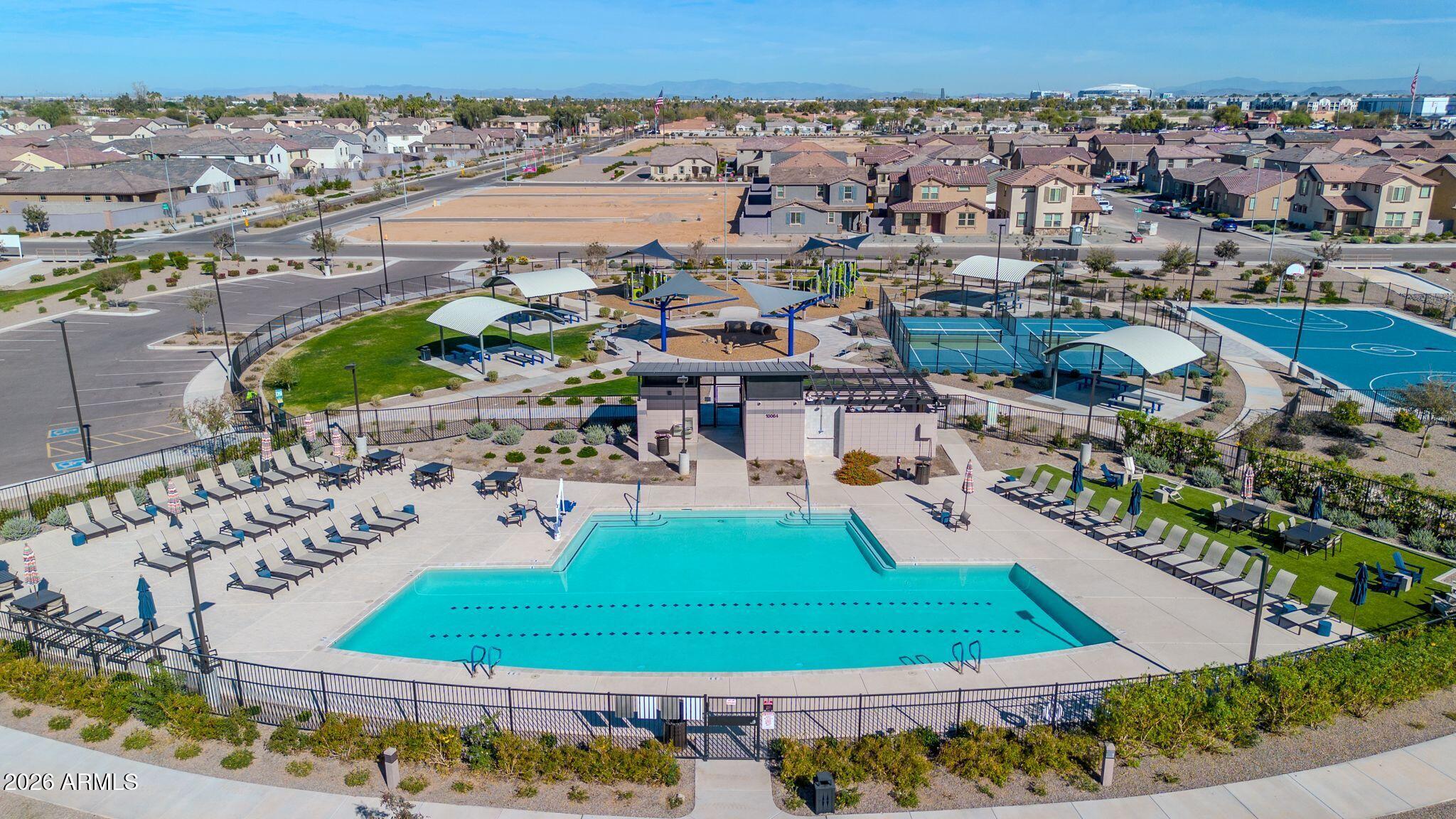 10223 West Piccadilly Road Avondale, AZ 85392 - Photo 31 of 35 an aerial view of a house with a swimming pool yard and lake view in back