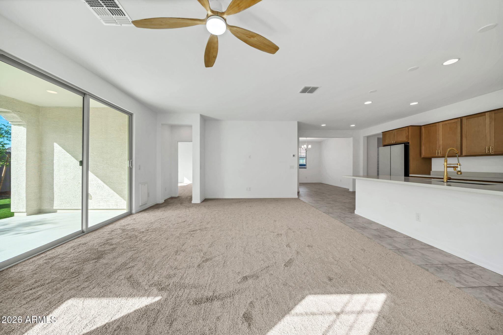 10223 West Piccadilly Road Avondale, AZ 85392 - Photo 4 of 35 a view of a kitchen with a sink and a window