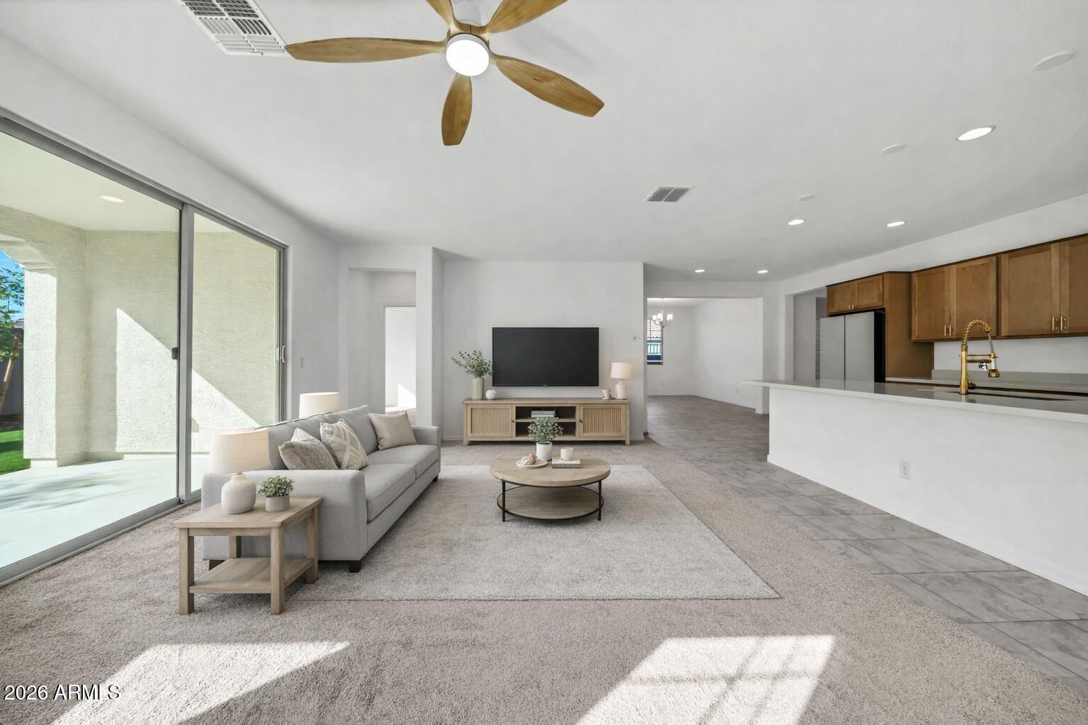10223 West Piccadilly Road Avondale, AZ 85392 - Photo 5 of 35 a living room with furniture and a flat screen tv