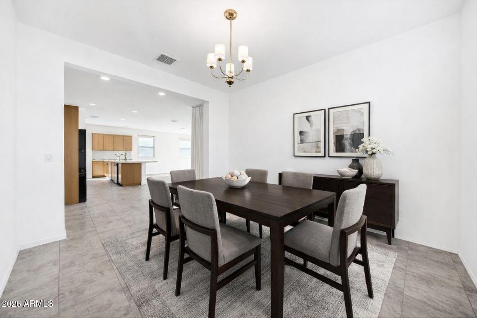 10223 West Piccadilly Road Avondale, AZ 85392 - Photo 6 of 35 a view of a dining room with furniture and chandelier