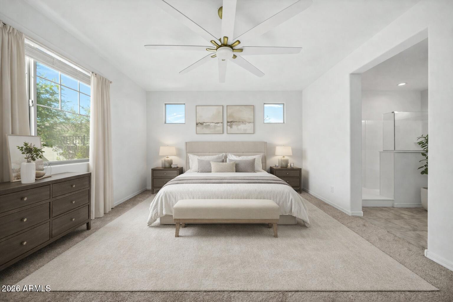 10223 West Piccadilly Road Avondale, AZ 85392 - Photo 7 of 35 a spacious bedroom with a bed and a window