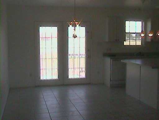 218 Oak Ridge Drive Corpus Christi, TX 78418 - Photo 4 of 8 a view of an empty room with a window