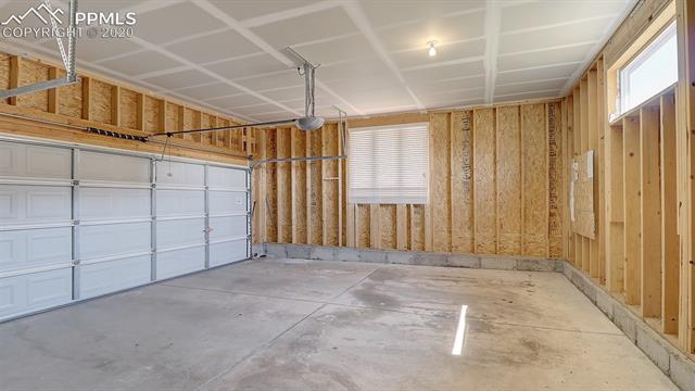 2316 Rusty Ridge Court Colorado Springs, CO 80921 - Photo 19 of 46 1 of 2 garages. Notice the tall ceilings. This garage is oversized and holds trash cans and/or tools out of the way.