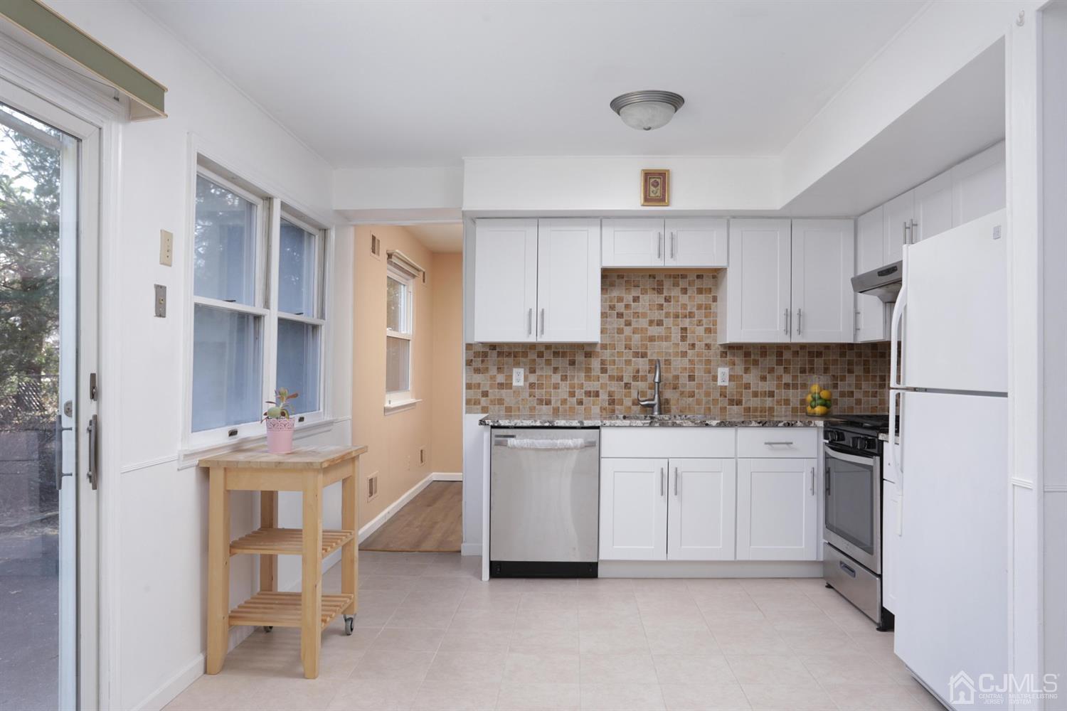 40 Azalea Drive Edison, NJ 08820 - Photo 14 of 36 a kitchen with stainless steel appliances granite countertop a refrigerator and a stove top oven