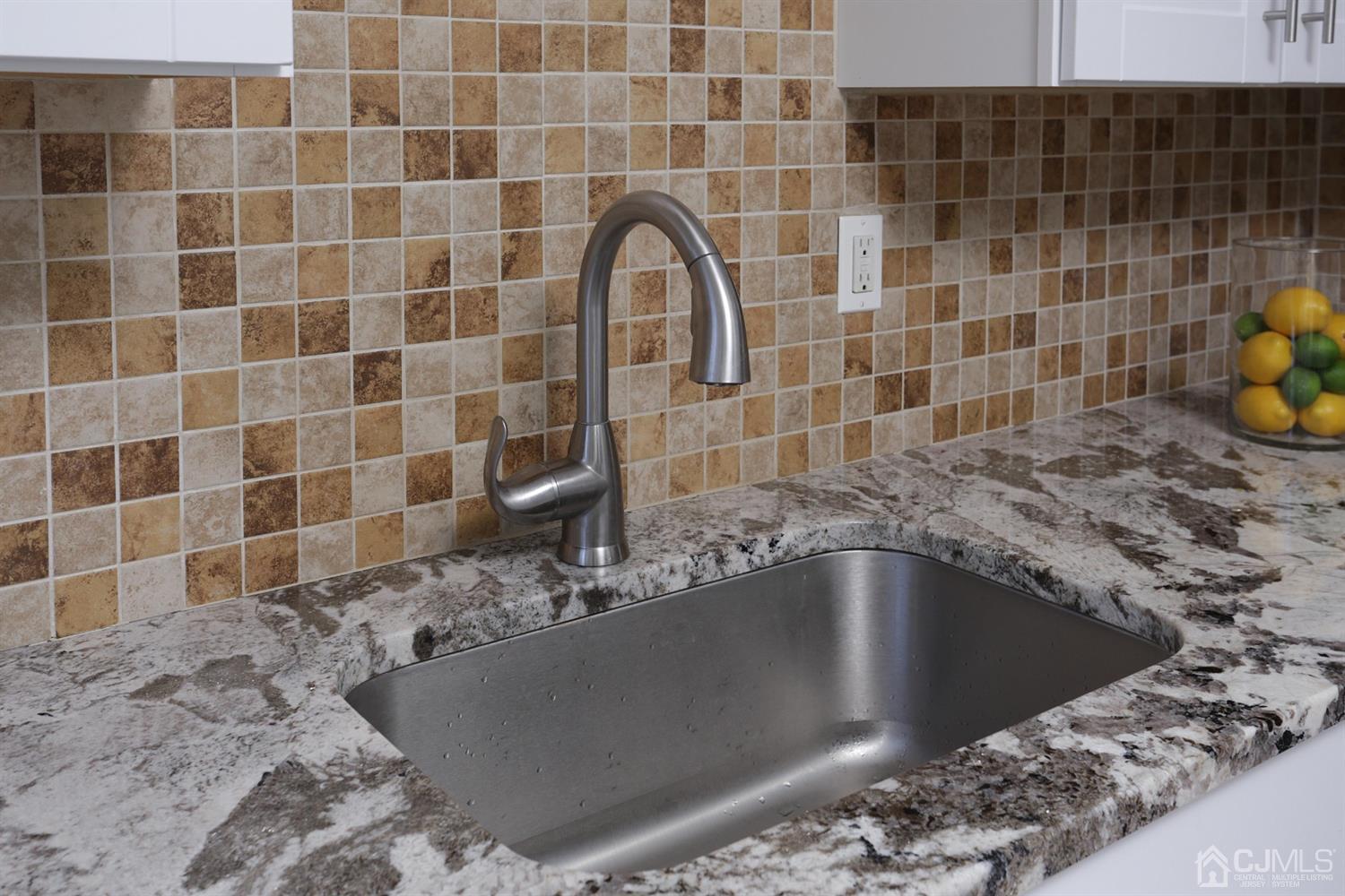 40 Azalea Drive Edison, NJ 08820 - Photo 16 of 36 a bathroom with a granite countertop bathtub and sink