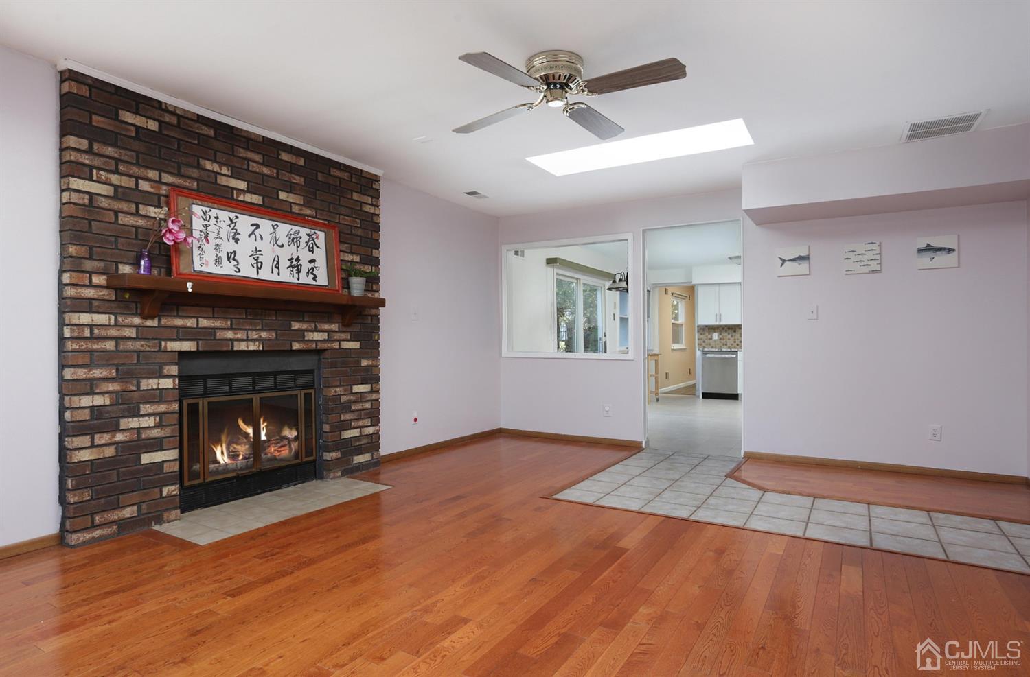 40 Azalea Drive Edison, NJ 08820 - Photo 22 of 36 a view of an empty room with a fireplace and a window