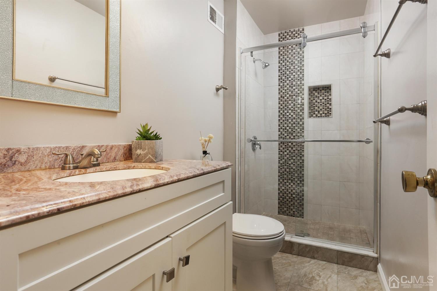 40 Azalea Drive Edison, NJ 08820 - Photo 24 of 36 a bathroom with a granite countertop sink toilet and shower