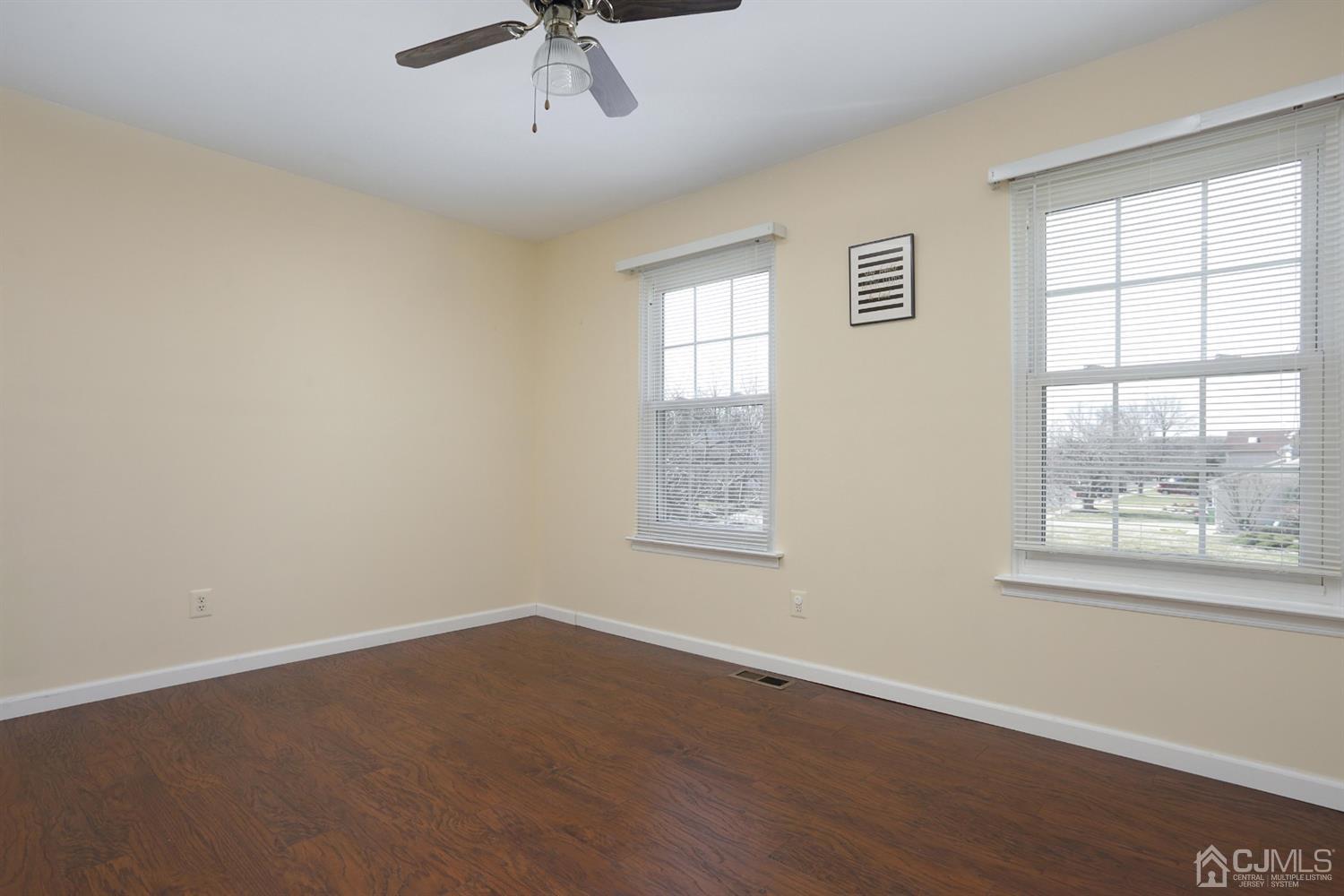 40 Azalea Drive Edison, NJ 08820 - Photo 26 of 36 a view of an empty room with a window and wooden floor