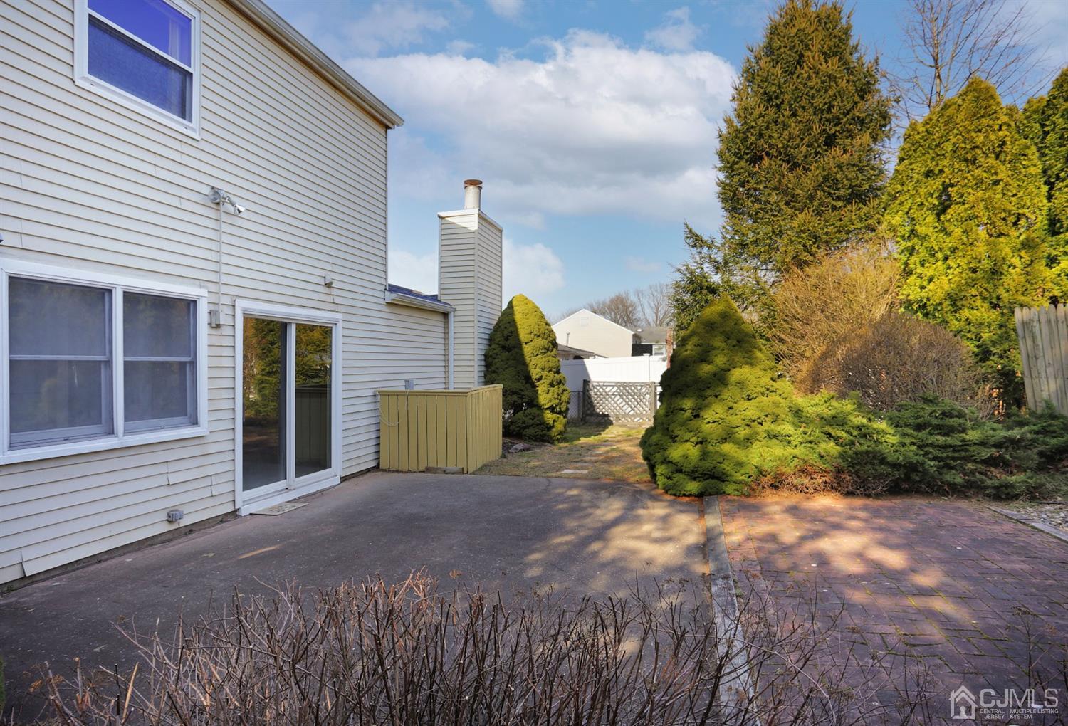 40 Azalea Drive Edison, NJ 08820 - Photo 31 of 36 a view of a house with a backyard and porch
