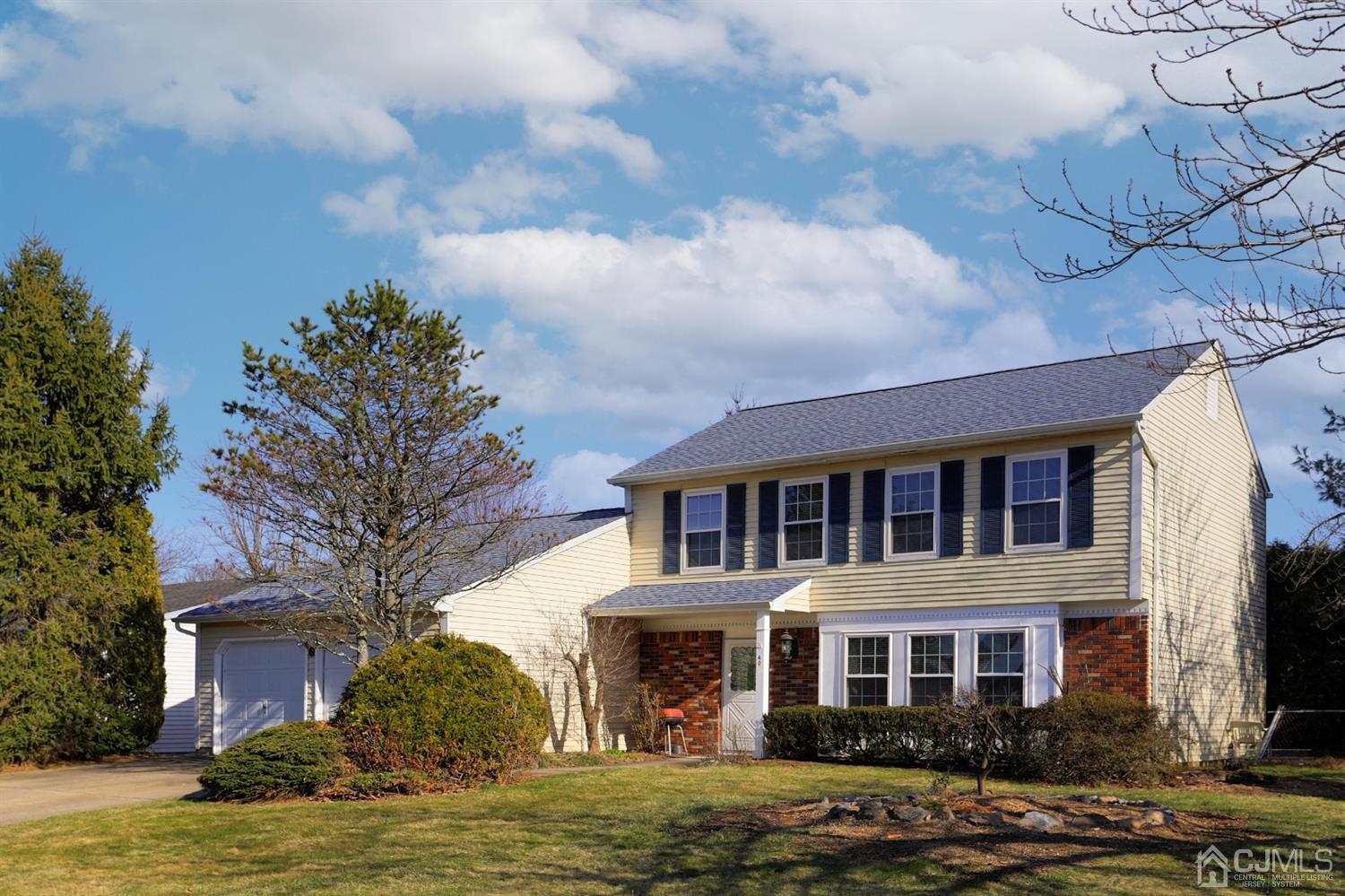 40 Azalea Drive Edison, NJ 08820 - Photo 5 of 36 a view of a building with a yard