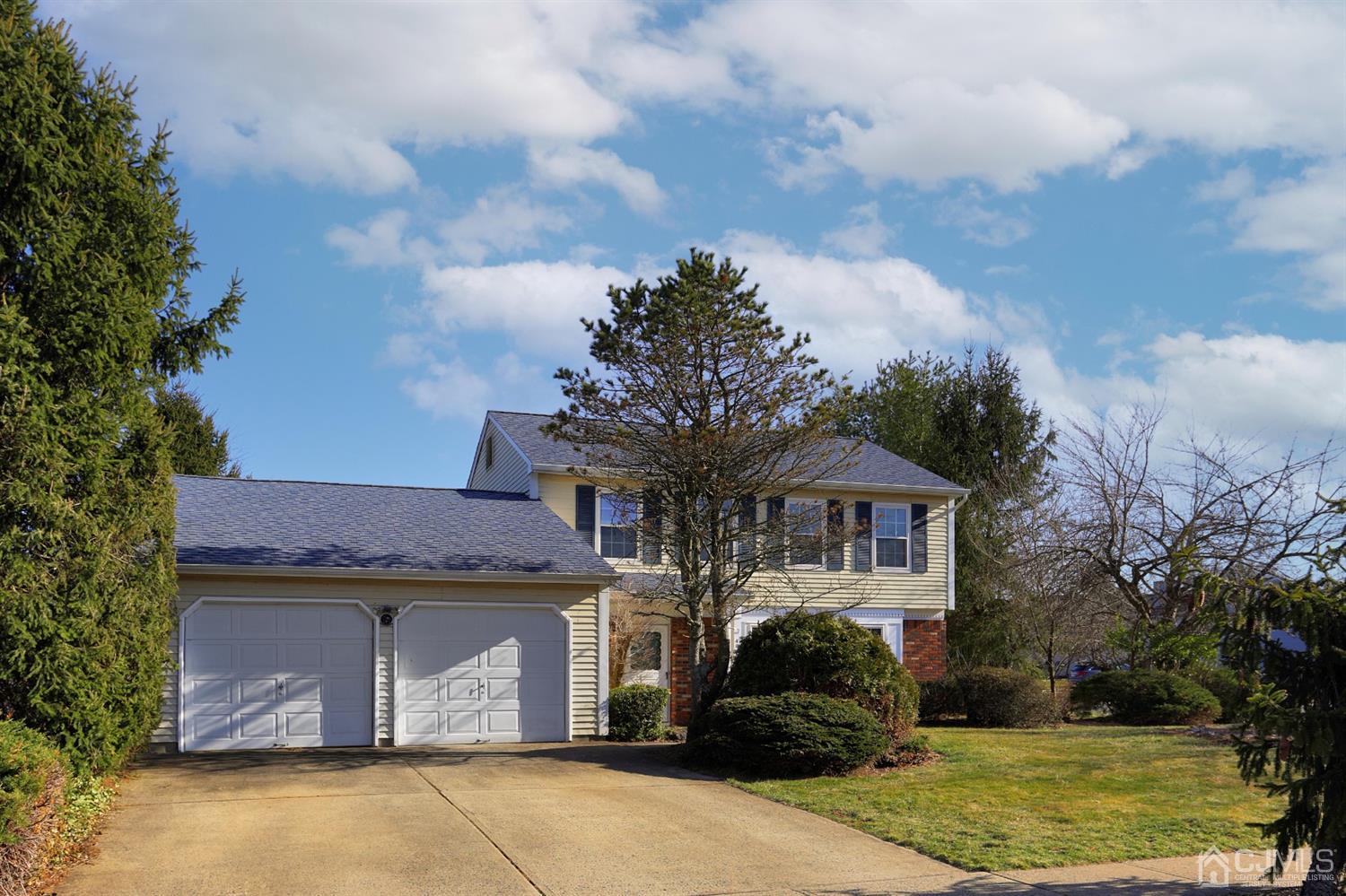 40 Azalea Drive Edison, NJ 08820 - Photo 6 of 36 a front view of a house with a garden