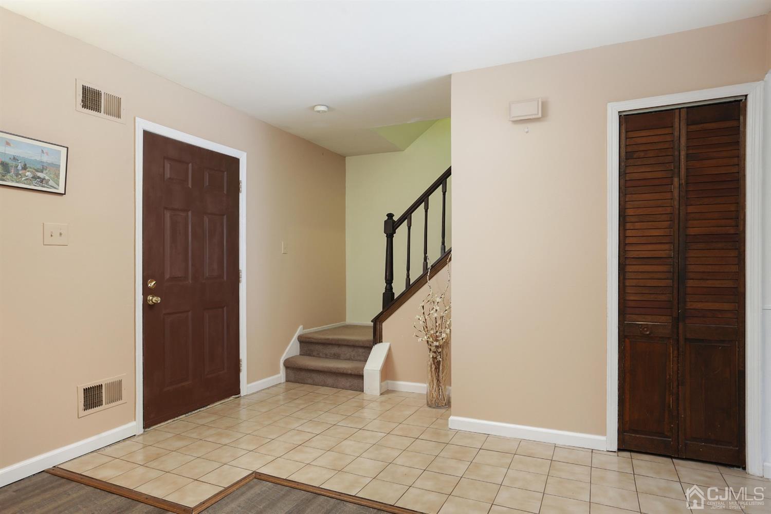 40 Azalea Drive Edison, NJ 08820 - Photo 7 of 36 a view of an entryway with staircase