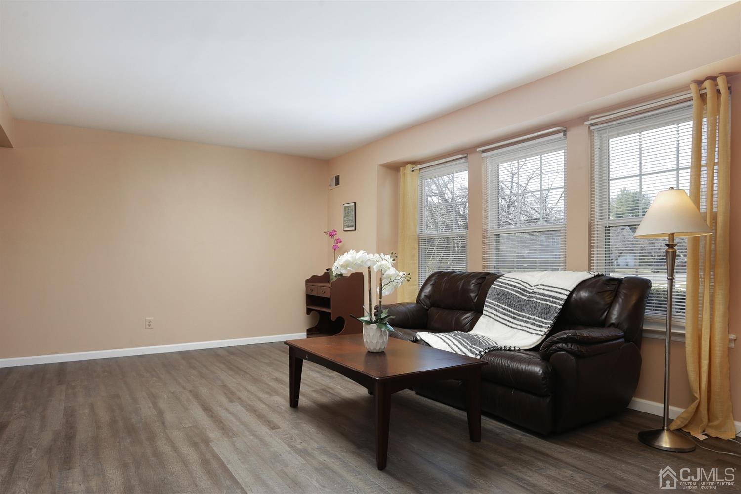 40 Azalea Drive Edison, NJ 08820 - Photo 9 of 36 a living room with furniture and floor to ceiling windows