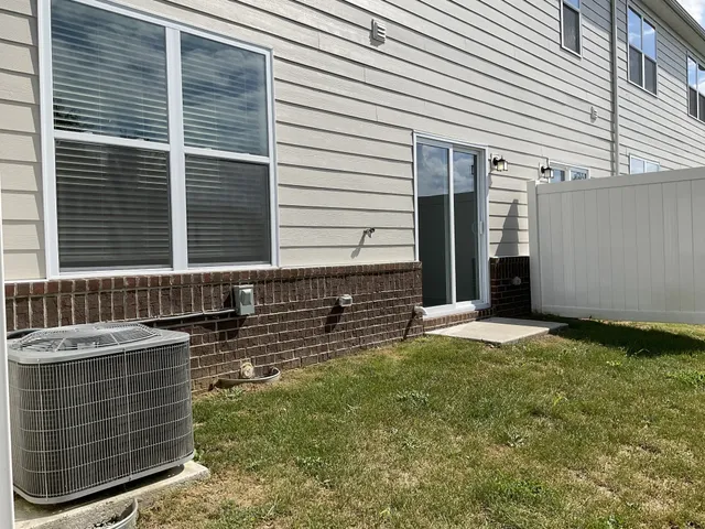 a view of house with backyard