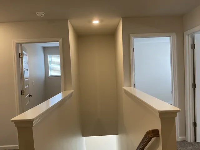 a view of hallway with mirror