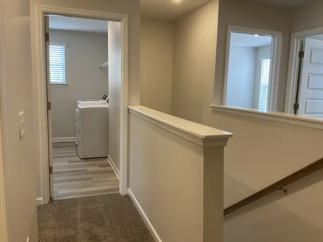 a view of a bathroom from a hallway