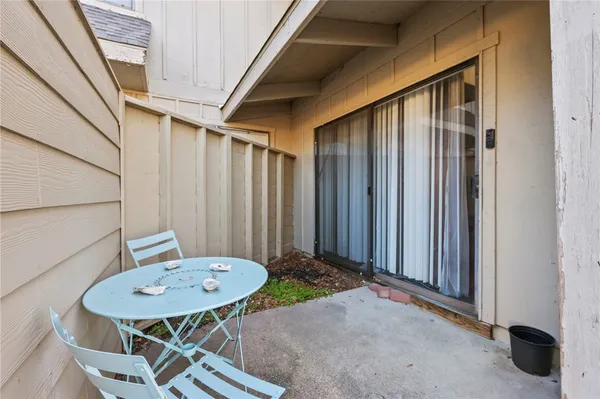 a view of a backyard with furniture