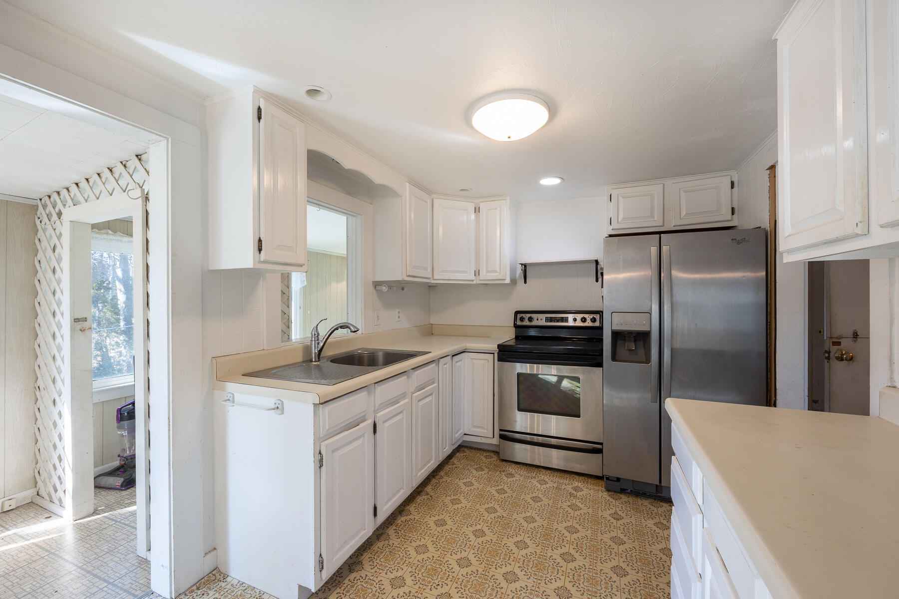 441 Old Town Road Hyannis, MA 02601 - Photo 9 of 42 a kitchen with a sink a refrigerator and a stove top oven