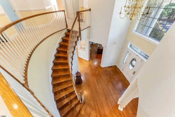 a view of an entryway with wooden floor
