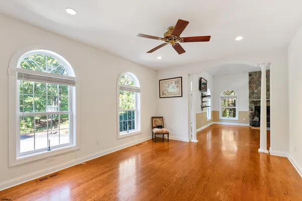 a large kitchen with stainless steel appliances kitchen island granite countertop a large counter top a stove a sink and a refrigerator