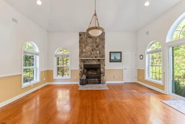 a large kitchen with a table and chairs