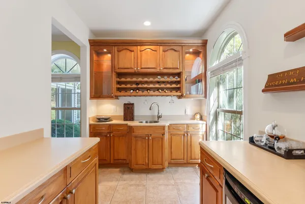 a kitchen with stainless steel appliances granite countertop a stove a sink dishwasher and a refrigerator