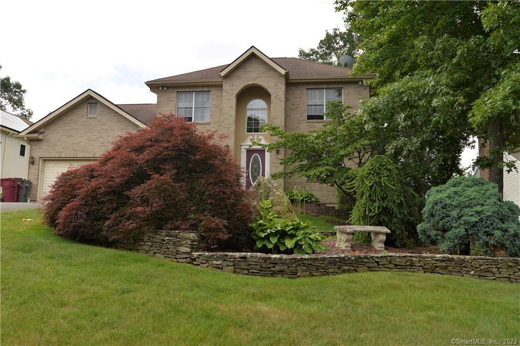 66 Jolie Road Naugatuck, CT 06770 - Photo 1 of 1 a front view of a house with a garden