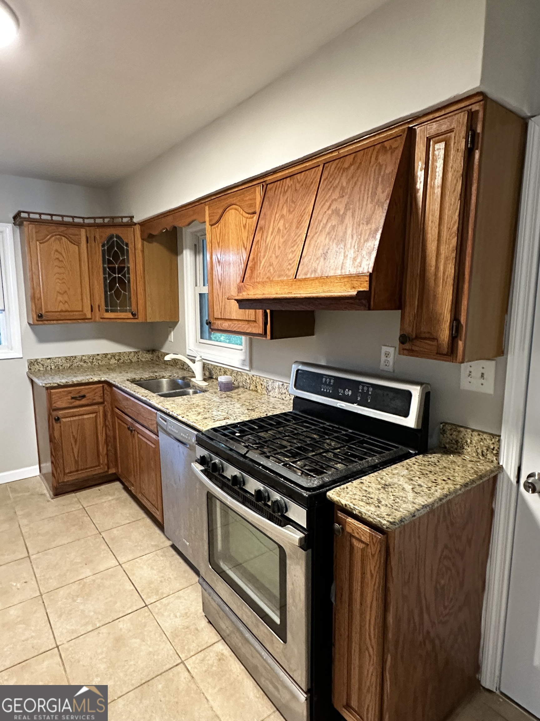 1865 Vicki Lane Southeast Atlanta, GA 30316 - Photo 14 of 15 a kitchen with a stove a sink and a microwave