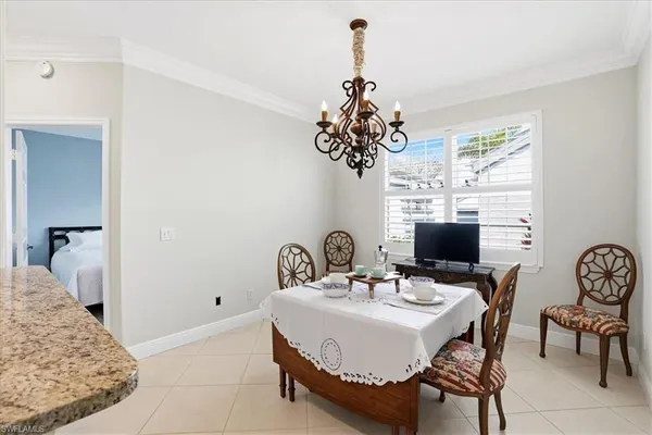 a very nice looking dining room with a table and chairs