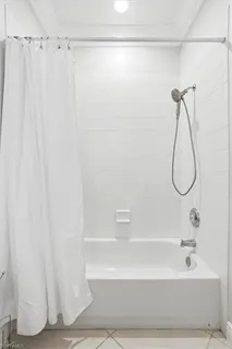 a bathroom with a shower and a shower