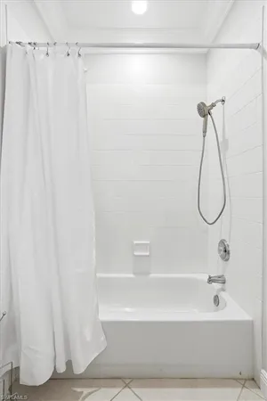 a bathroom with a shower and a shower