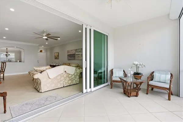 a living room with furniture and white walls