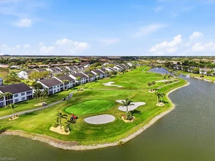 an aerial view of a residential houses with outdoor space