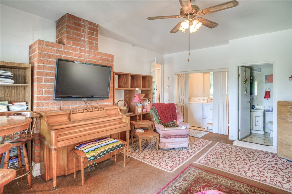 1361 Mt Ida Road Oroville, CA 95966 - Photo 12 of 44 a living room with furniture and a flat screen tv