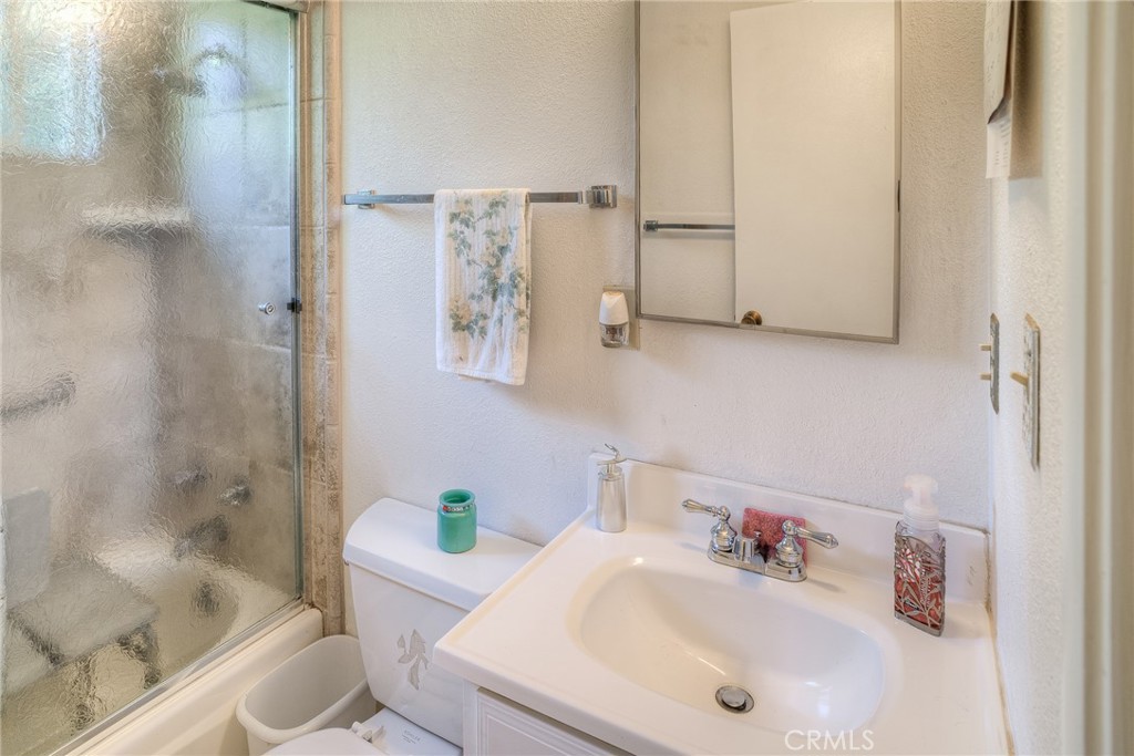 1361 Mt Ida Road Oroville, CA 95966 - Photo 17 of 44 a bathroom with a sink and a shower curtain