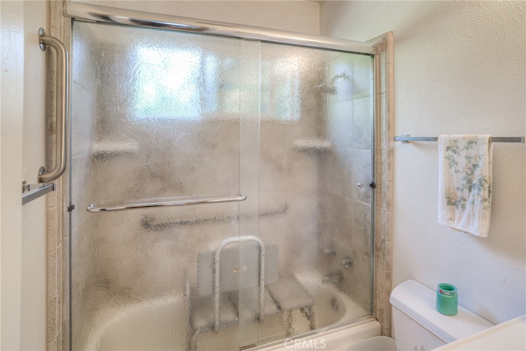 1361 Mt Ida Road Oroville, CA 95966 - Photo 18 of 44 a bathroom with a glass shower door